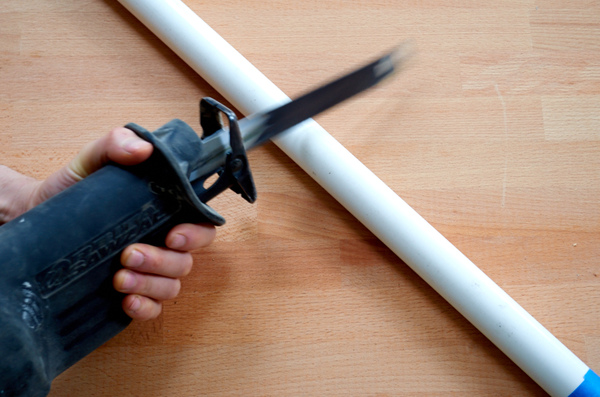 reciprocating saw cutting PVC pipe