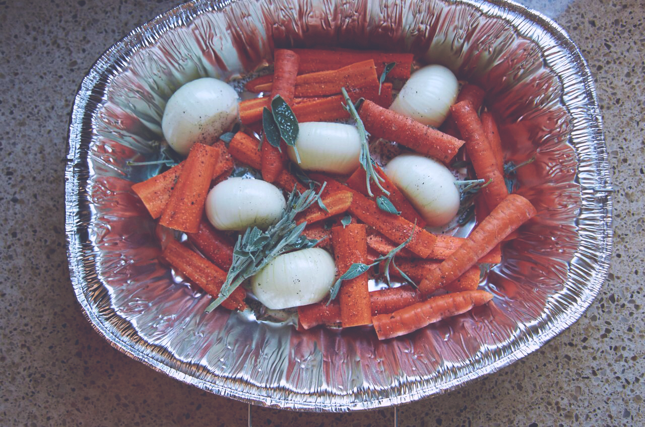 Bed of vegetables in a roasting pan