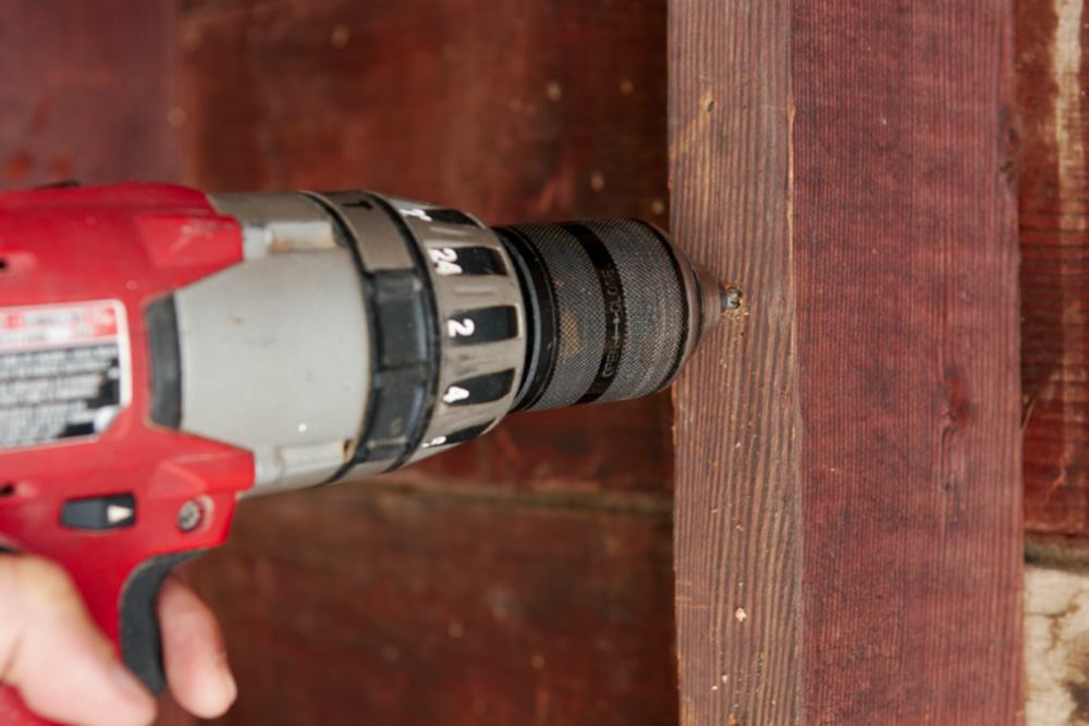 drilling a pilot hole for a screw hook