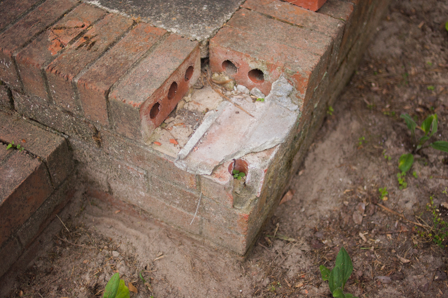 damaged and missing bricks from an entryway
