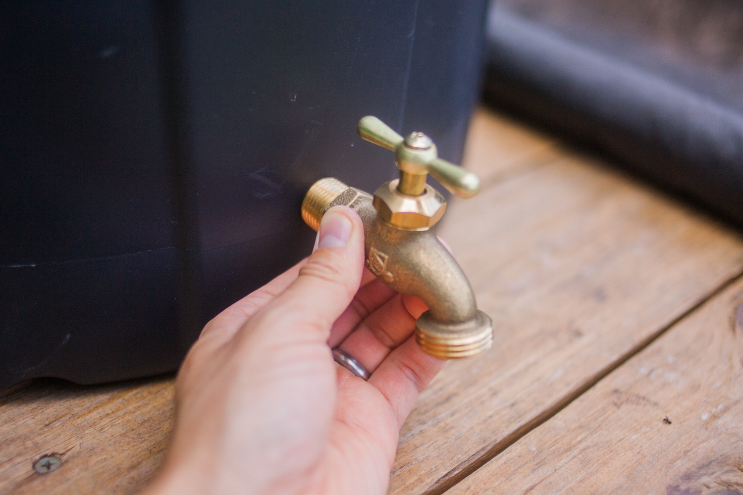 installing the spigot into the rain barrel