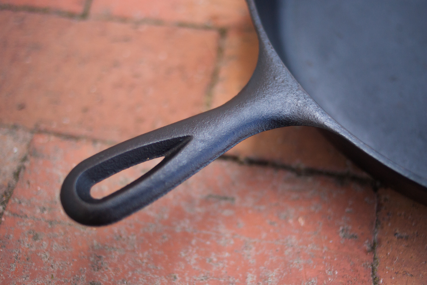 Handle of a cast iron skillet