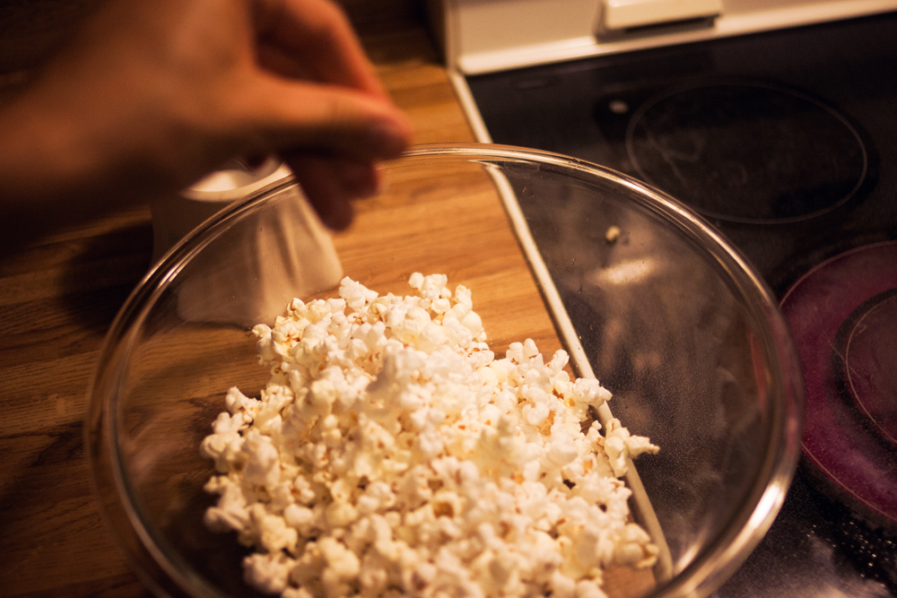 perfect stovetop popcorn - season each layer