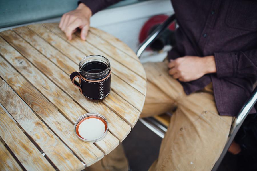 leather and glass coffee mug